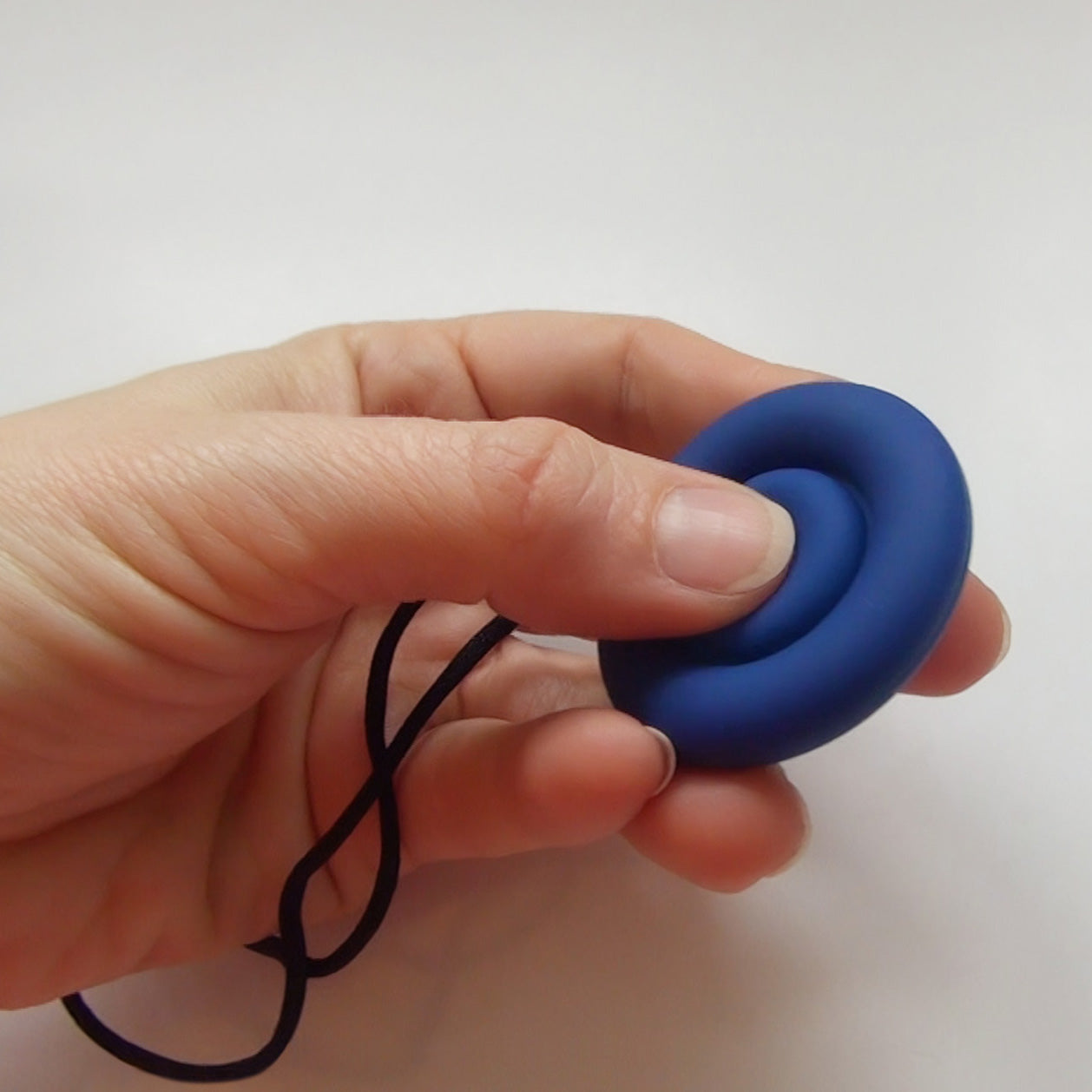Close up of adult using the Munchables Pop It Bubble Popper Fidget Sensory Toy