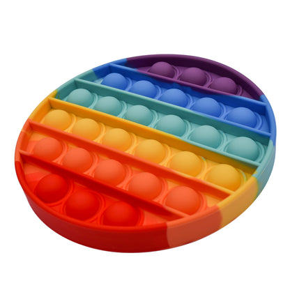 Side angle view of rainbow bubble popper fidget toy