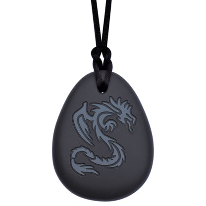 This Munchables Dragon Chew Necklace features a black silicone pendant wtih a grey dragon design. This chewelry is strung on a black cord with a break away clasp.